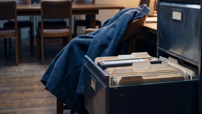 A filing drawer of personnel folders pulled open